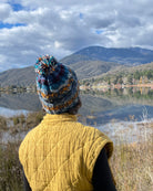 person wearing multicolour wool beanie