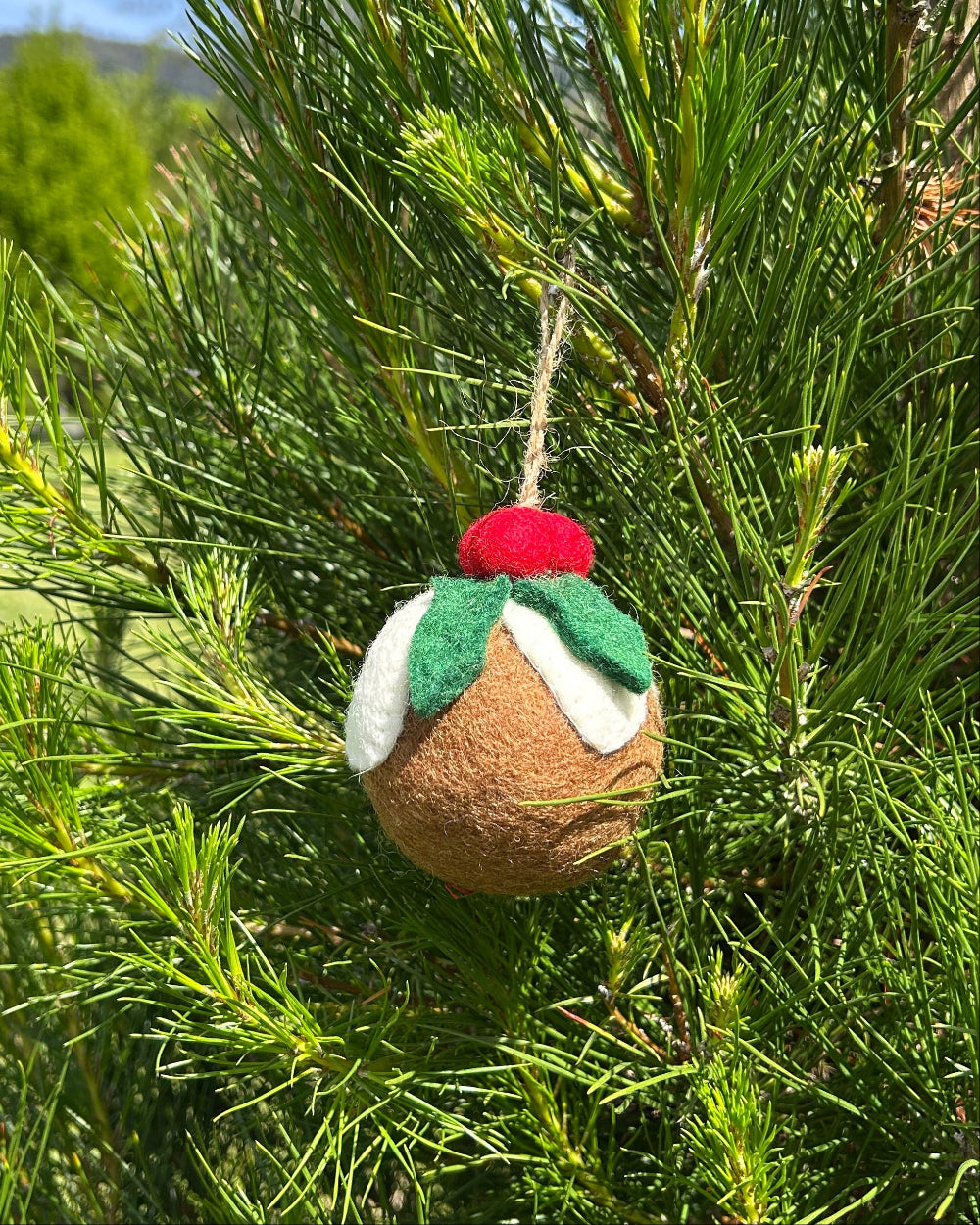 Felt Christmas pudding ornament hanging on a tree