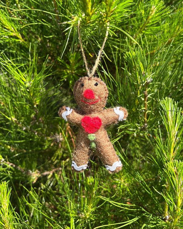 Gingerbread man decoration hanging in tree