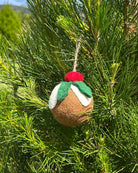 Felt Christmas pudding ornament hanging on a tree