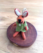 Felted bunny keychain on a wooden surface